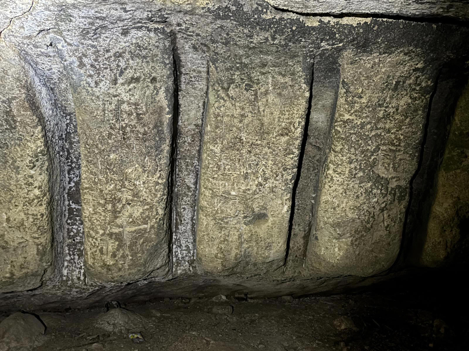 Rock-cut pilasters inside Għar Ħanżir