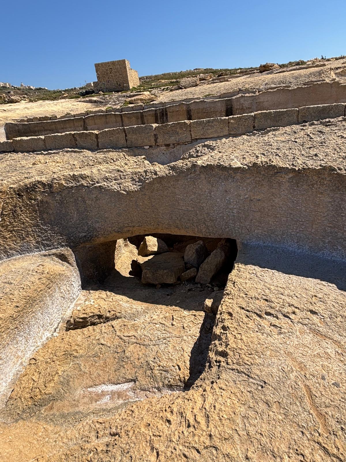Close up view down into the circular rock basin reservoir