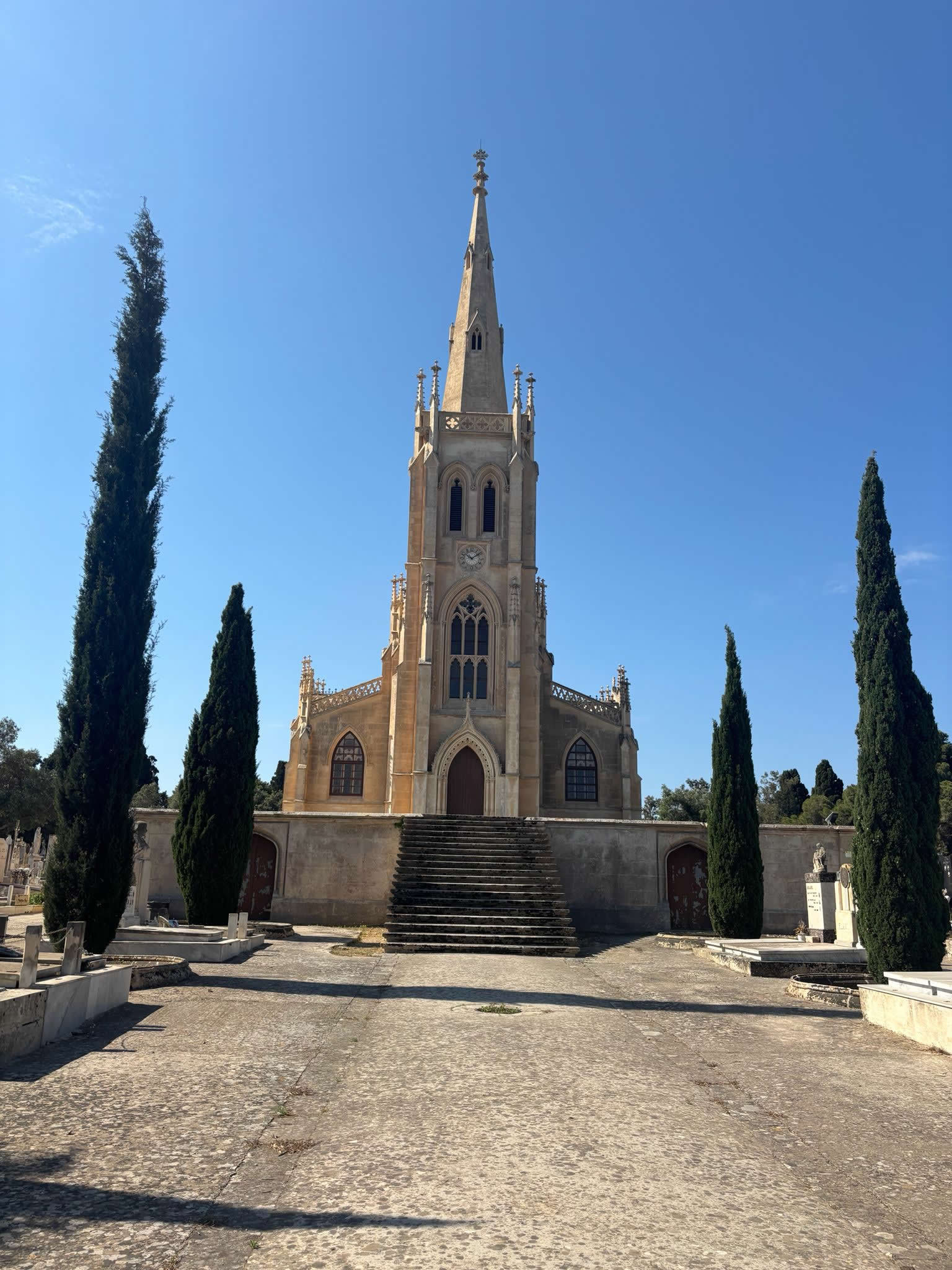 The dramatic Neo-Gothic architecture of Our Lady of Sorrows Chapel in Paola showing its soaring spire
