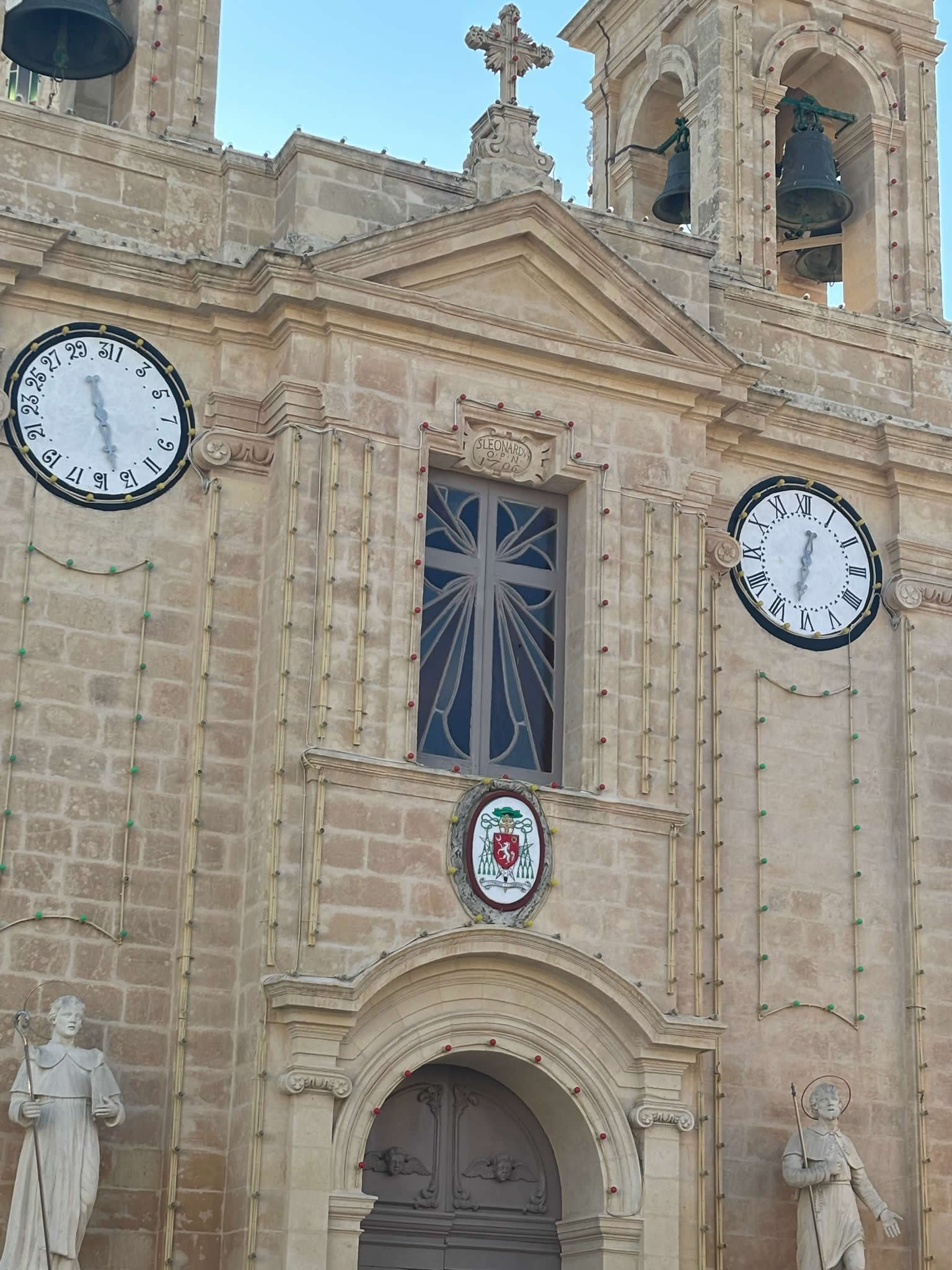 Baroque front facade and bell towers of St. Leonard's Parish Church in Kirkop