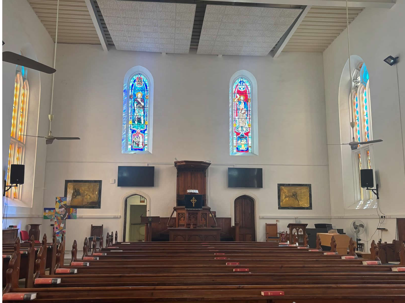 Interior of St Andrew’s Scots Church Valletta showing the alter and stained glass windows