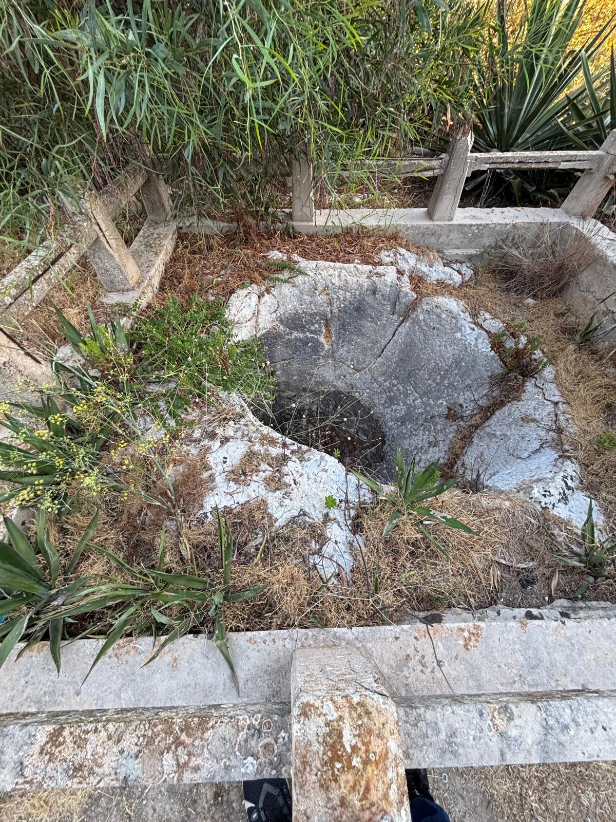 Ground level view tracking the 45-degree angling of the outer shoreline stone weapon face