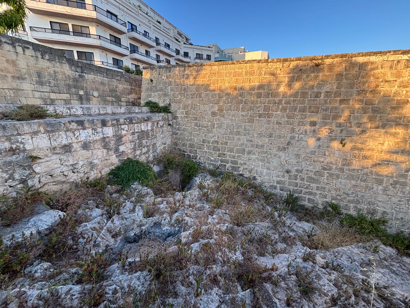 The rock-cut opening of the interior Fougasse looking down into the bedrock within Ximenes Redoubt