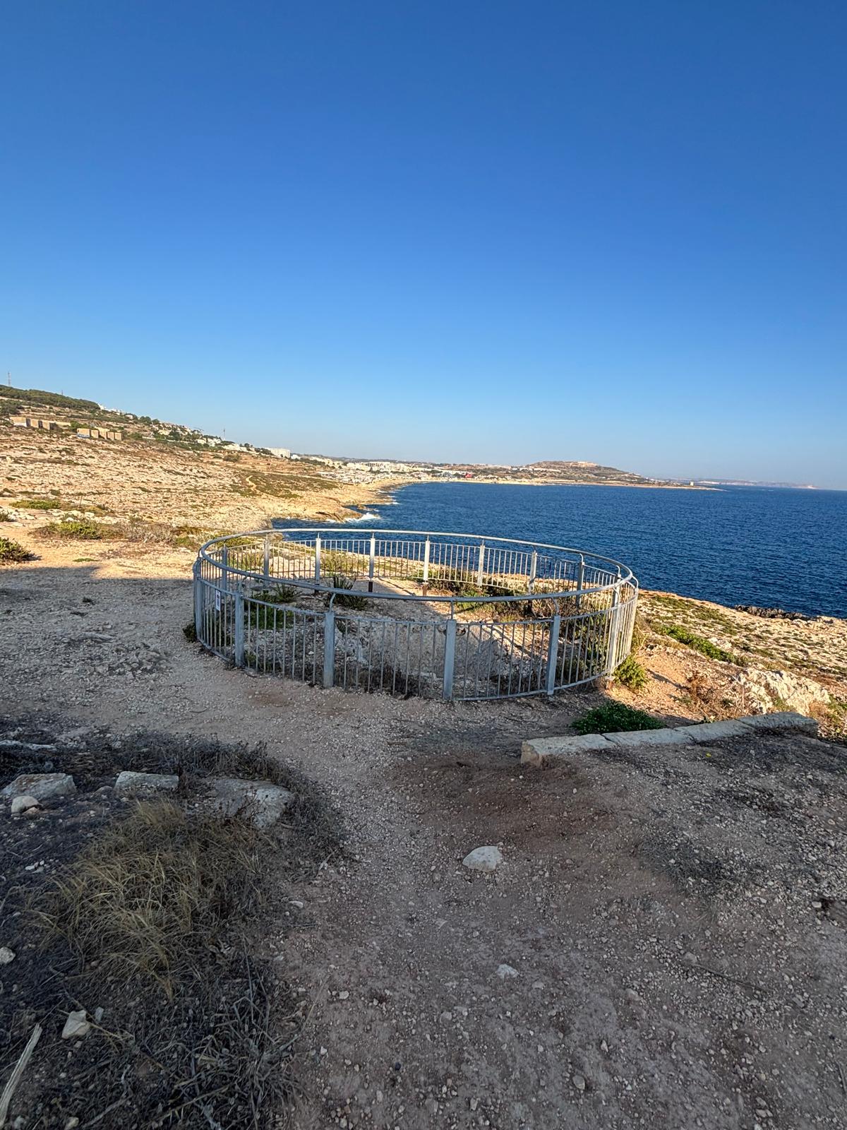 Panoramic perspective of the circular protective fence overlooking the open sea horizon near Pembroke