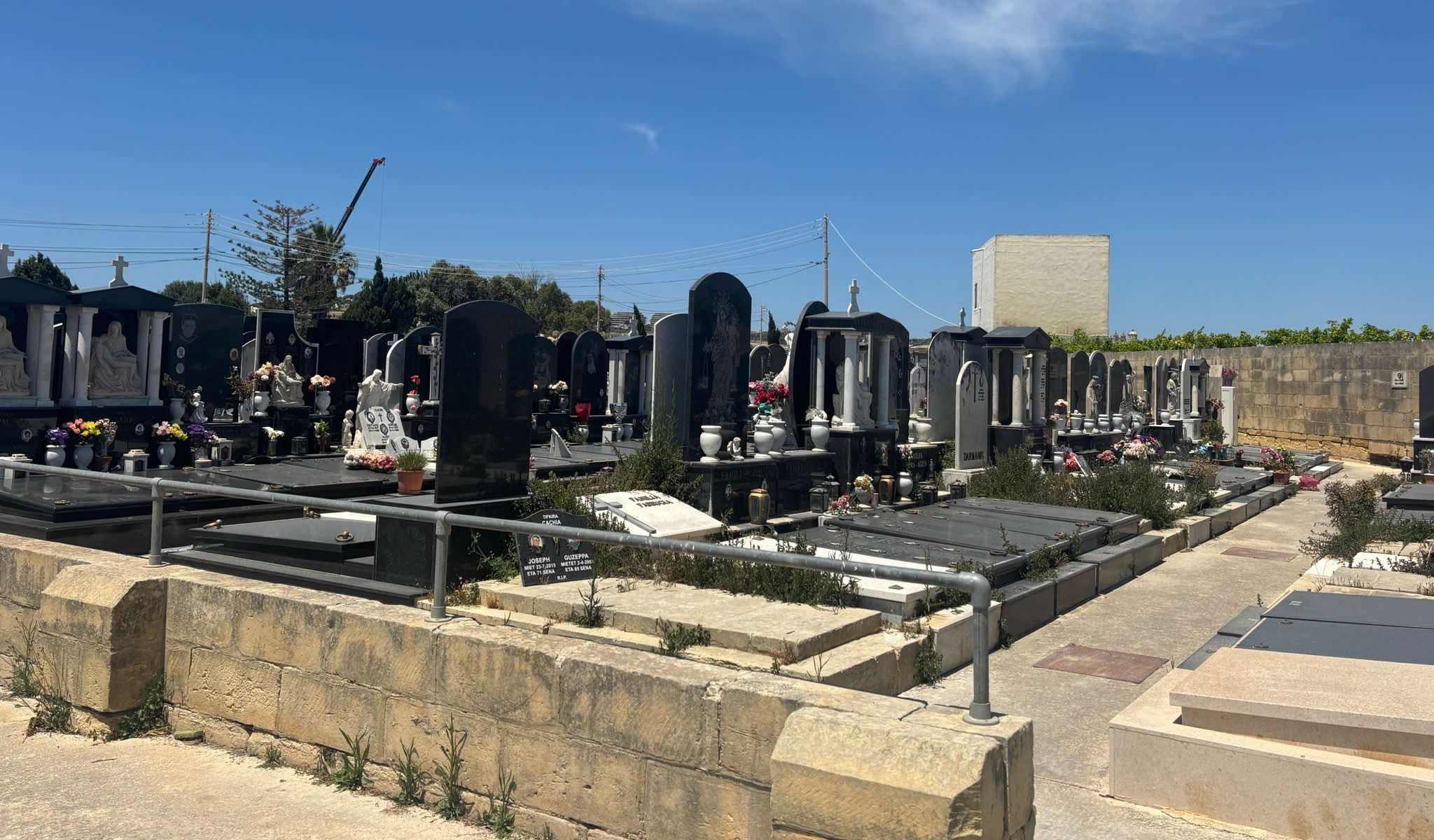 Interior view of modern granite tombs inside Sant' Andrija Cemetery