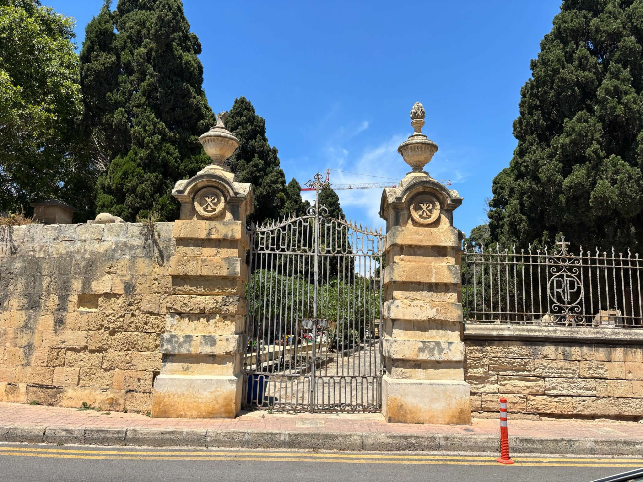 The historical far left gate showing 1676 plague architectural features