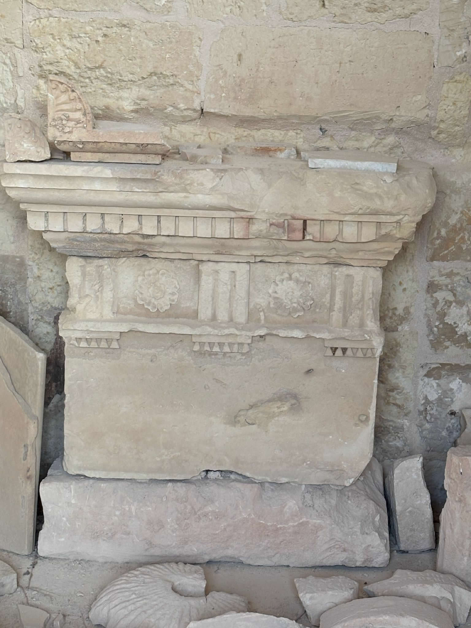 Neo-Classical architectural friezes and carved limestone relief panels saved from the cemetery