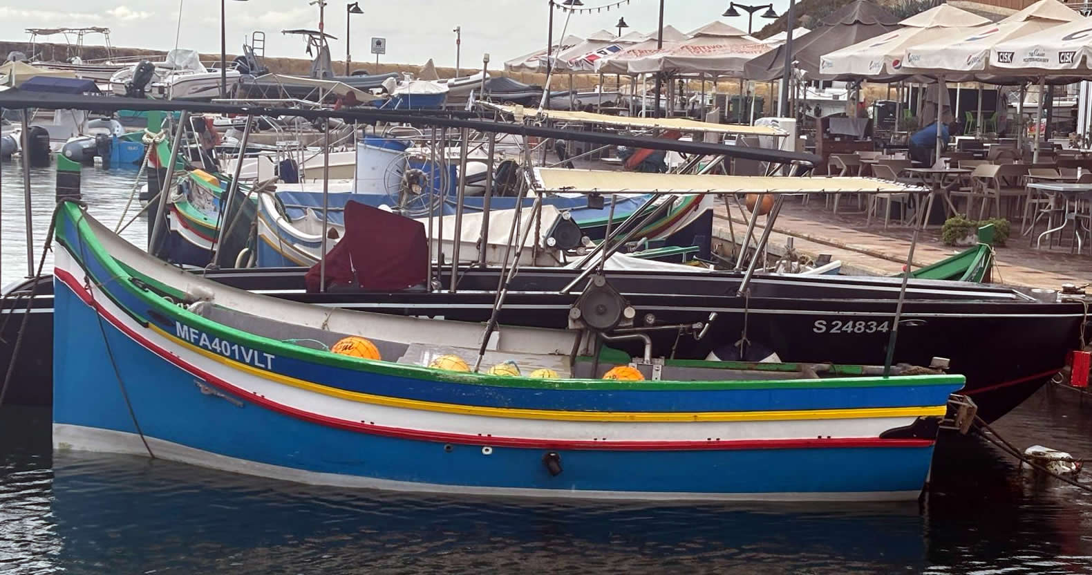 Traditional Maltese Luzzu fishing boats in Marsalforn Harbour