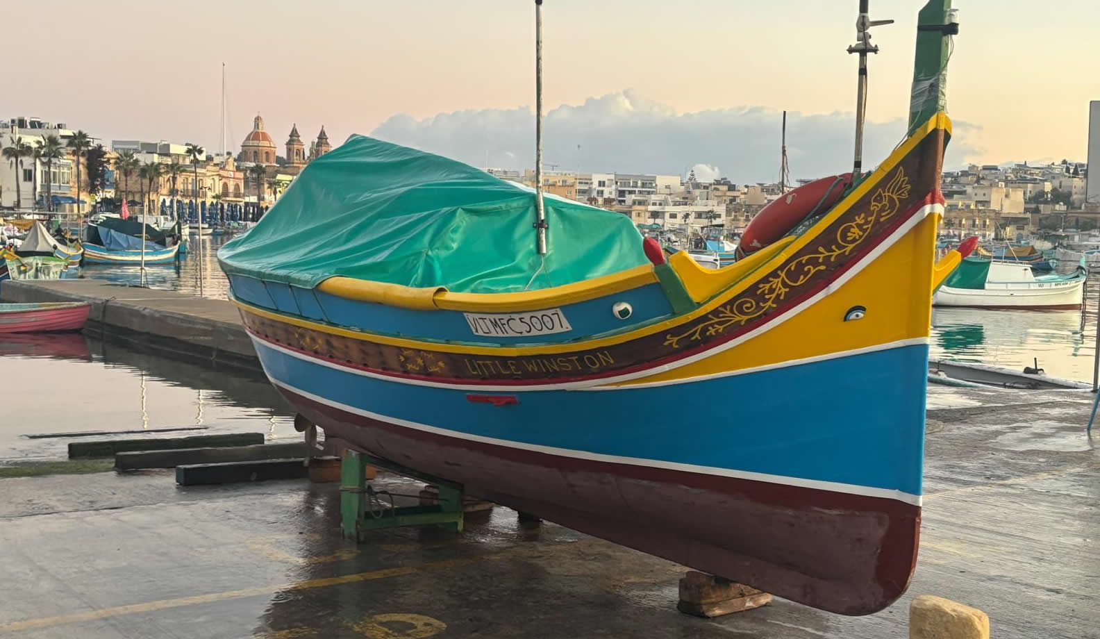 Traditional Maltese Luzzu fishing boats in Marsaxlokk Harbour