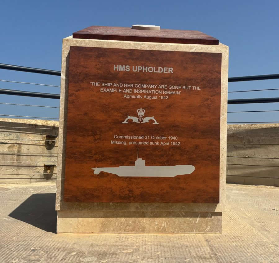HMS Upholder memorial plaque in Valletta, Malta, showcasing the submarine silhouette and Admiralty quote.