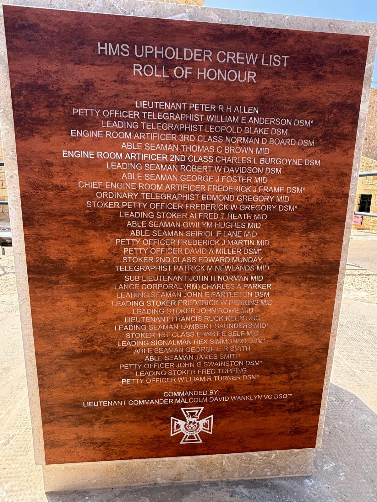 Close-up of the HMS Upholder Crew List Roll of Honour engraved on the side of the Malta memorial monument.