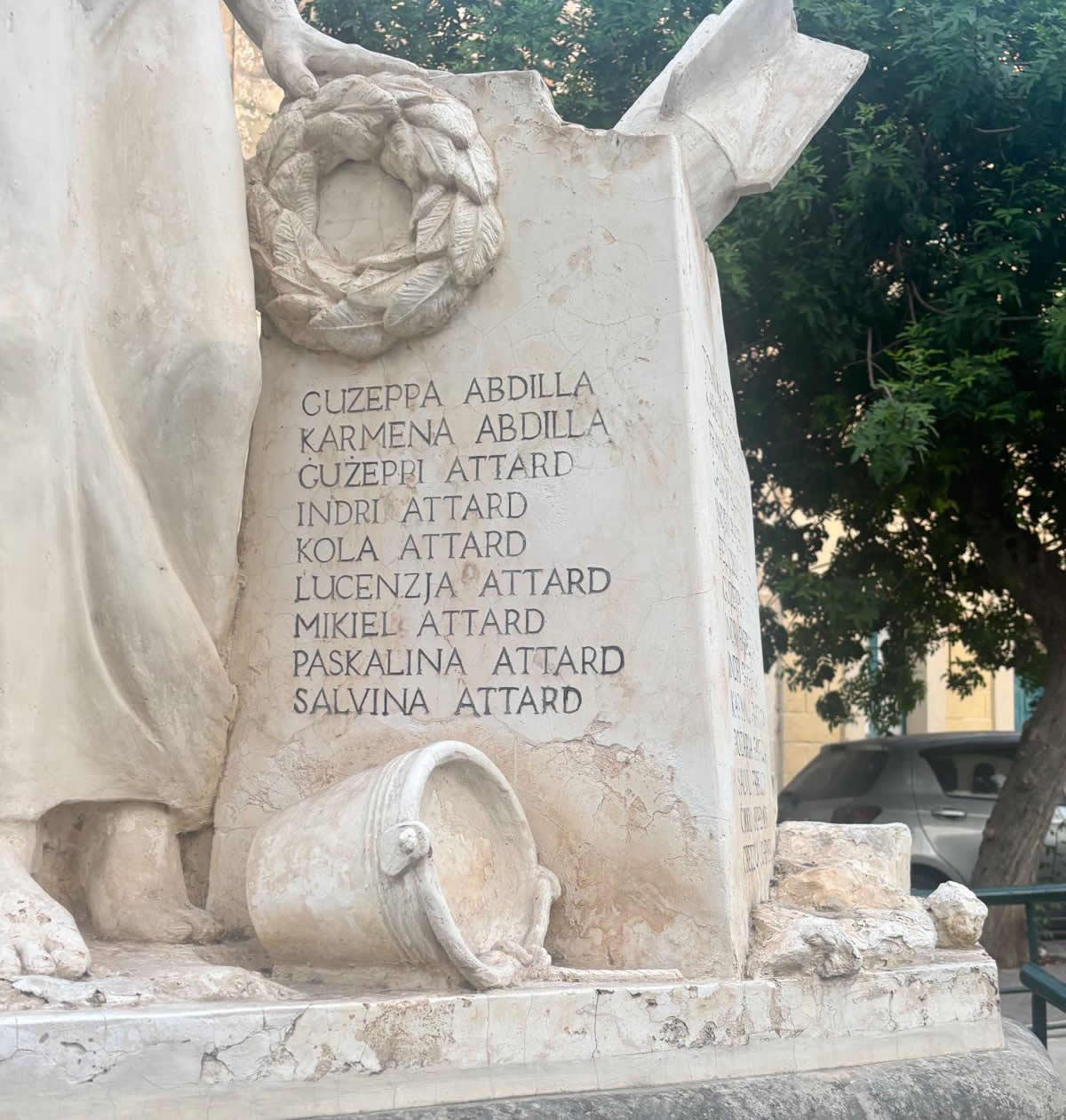 Close-up of the first panel of names on the Luqa World War II memorial