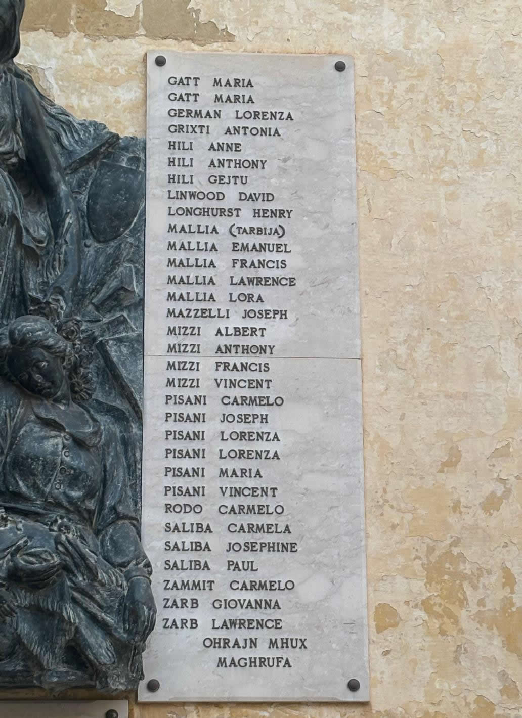 
                Close-up view of the right marble panel on the Birgu war memorial containing names from Gatt to Zarb, and unknown victims.
