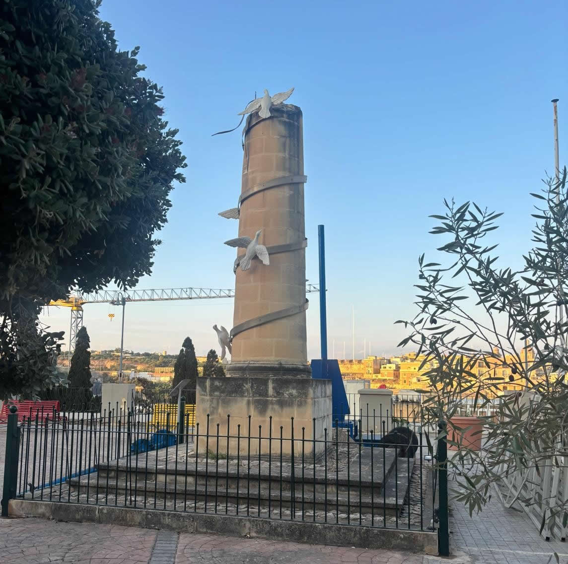 Kalkara War Memorial, side view showing the cylindrical column and doves