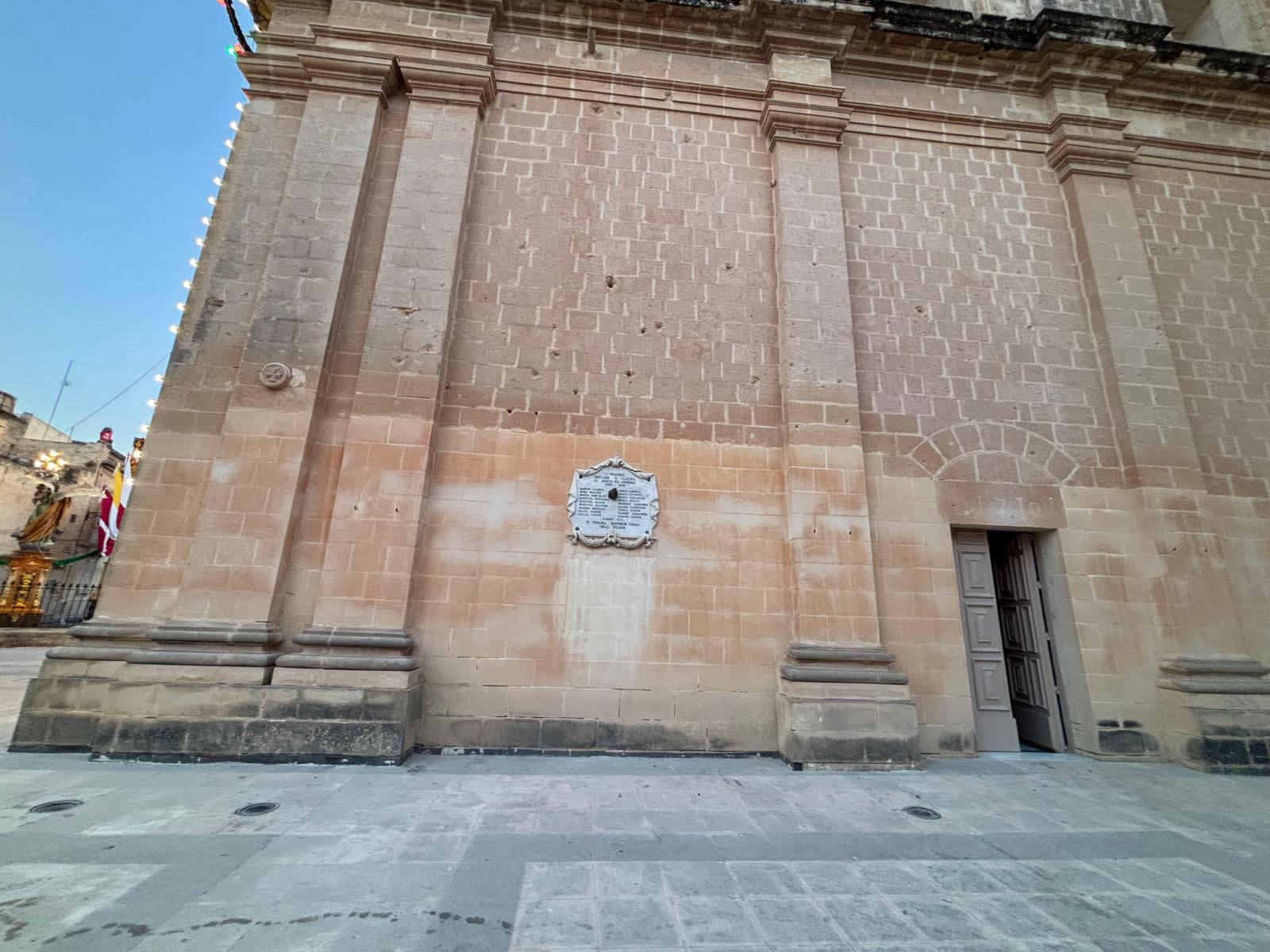 Mqabba Malta World War II War Memorial 1939–1945 on the exterior wall of the parish church