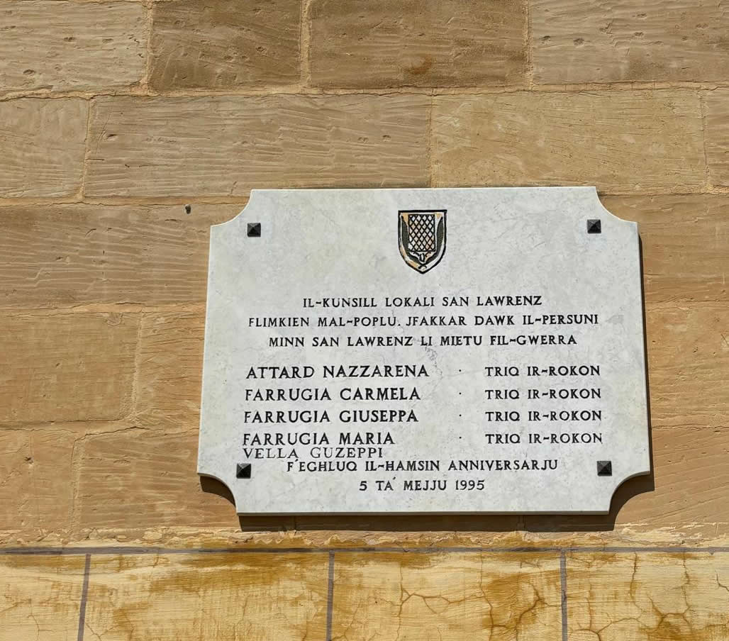 Close-up of the San Lawrenz Second World War memorial plaque listing five victims